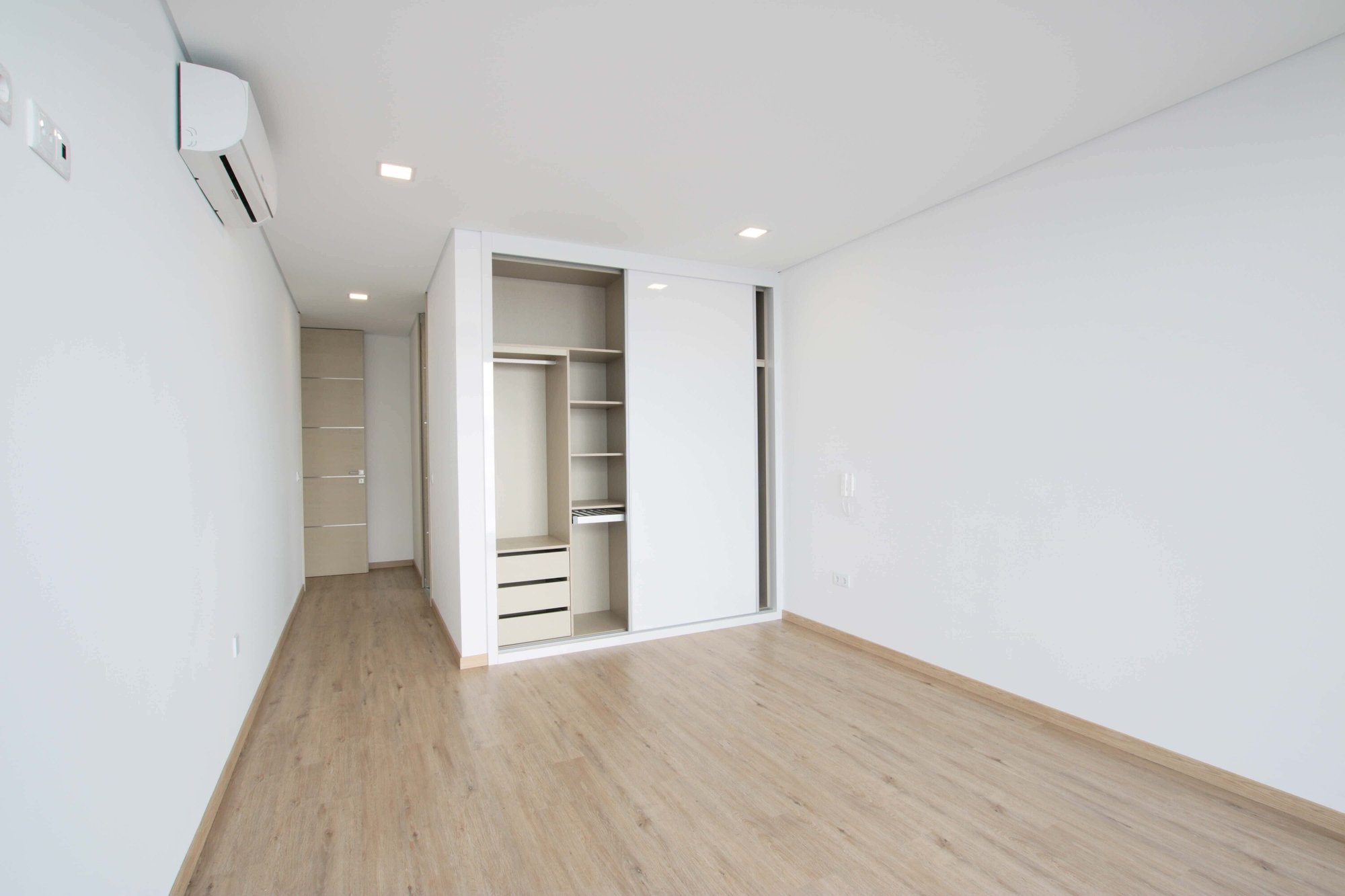 Empty bedroom with a closet