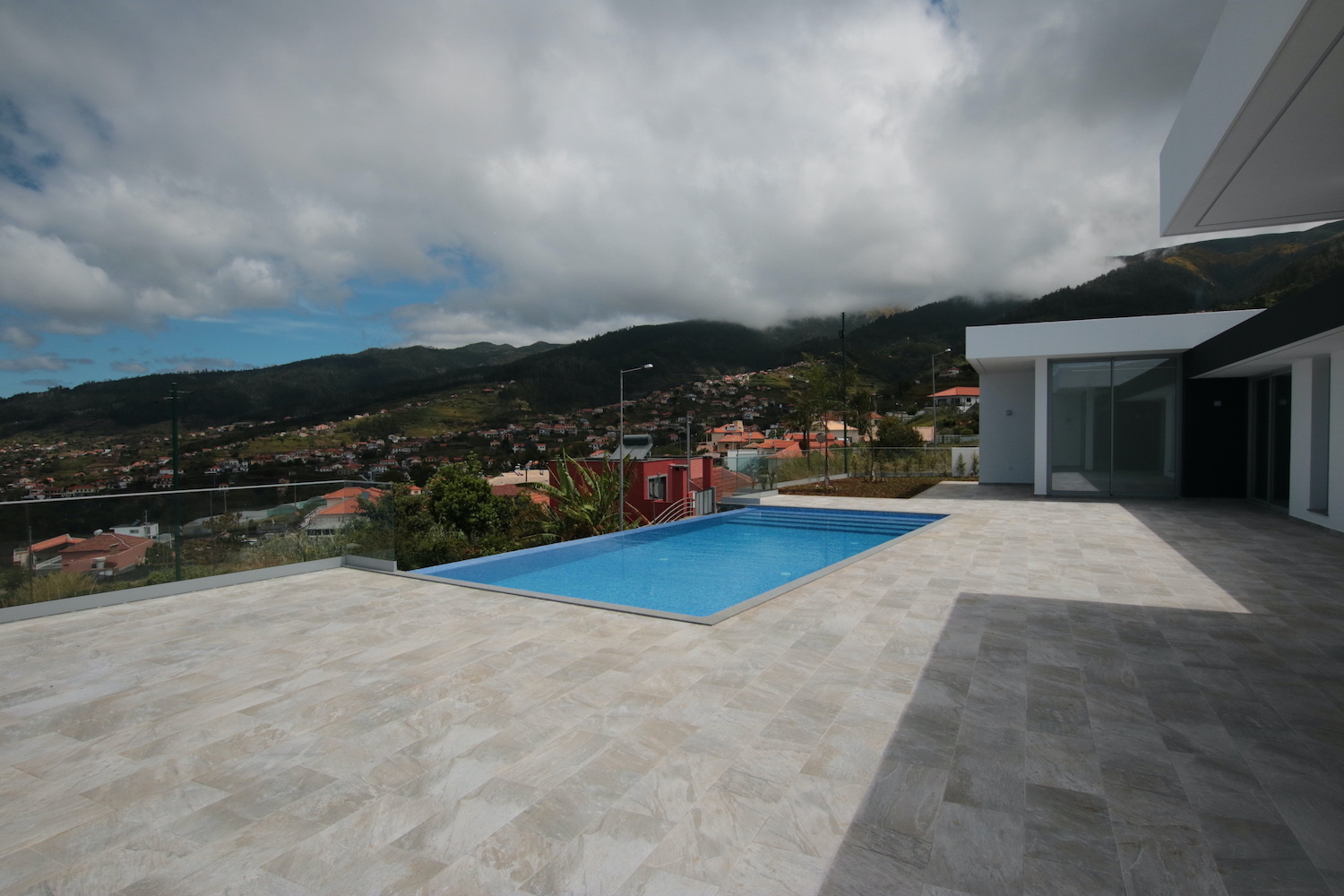 Front of the property with swimming pool