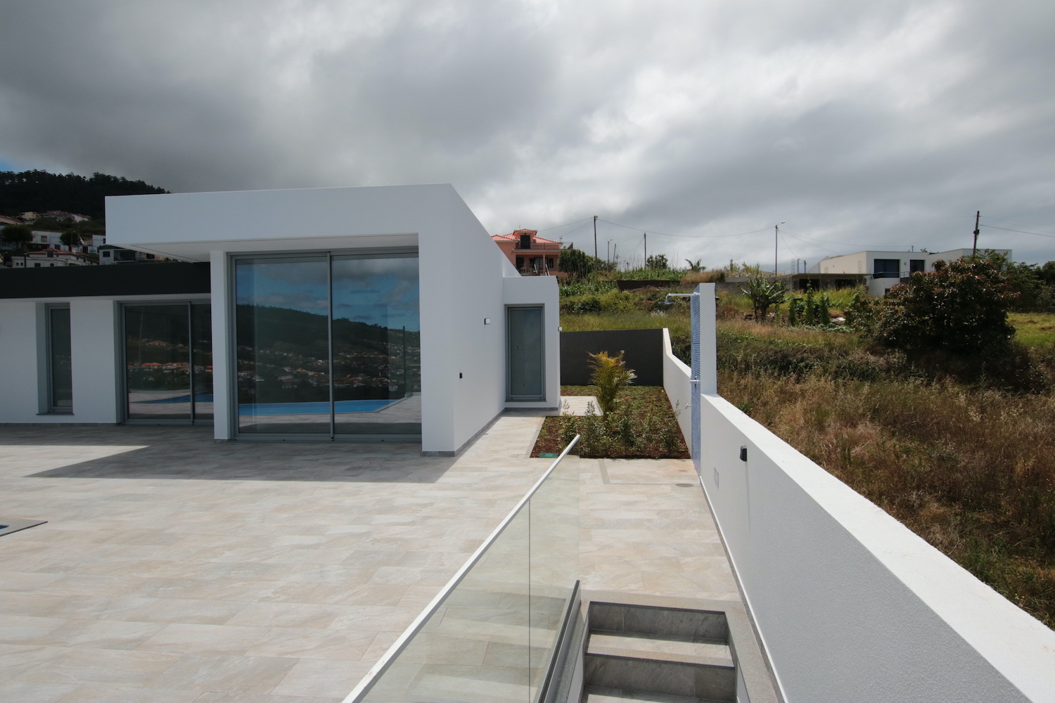 Front of the property with swimming pool