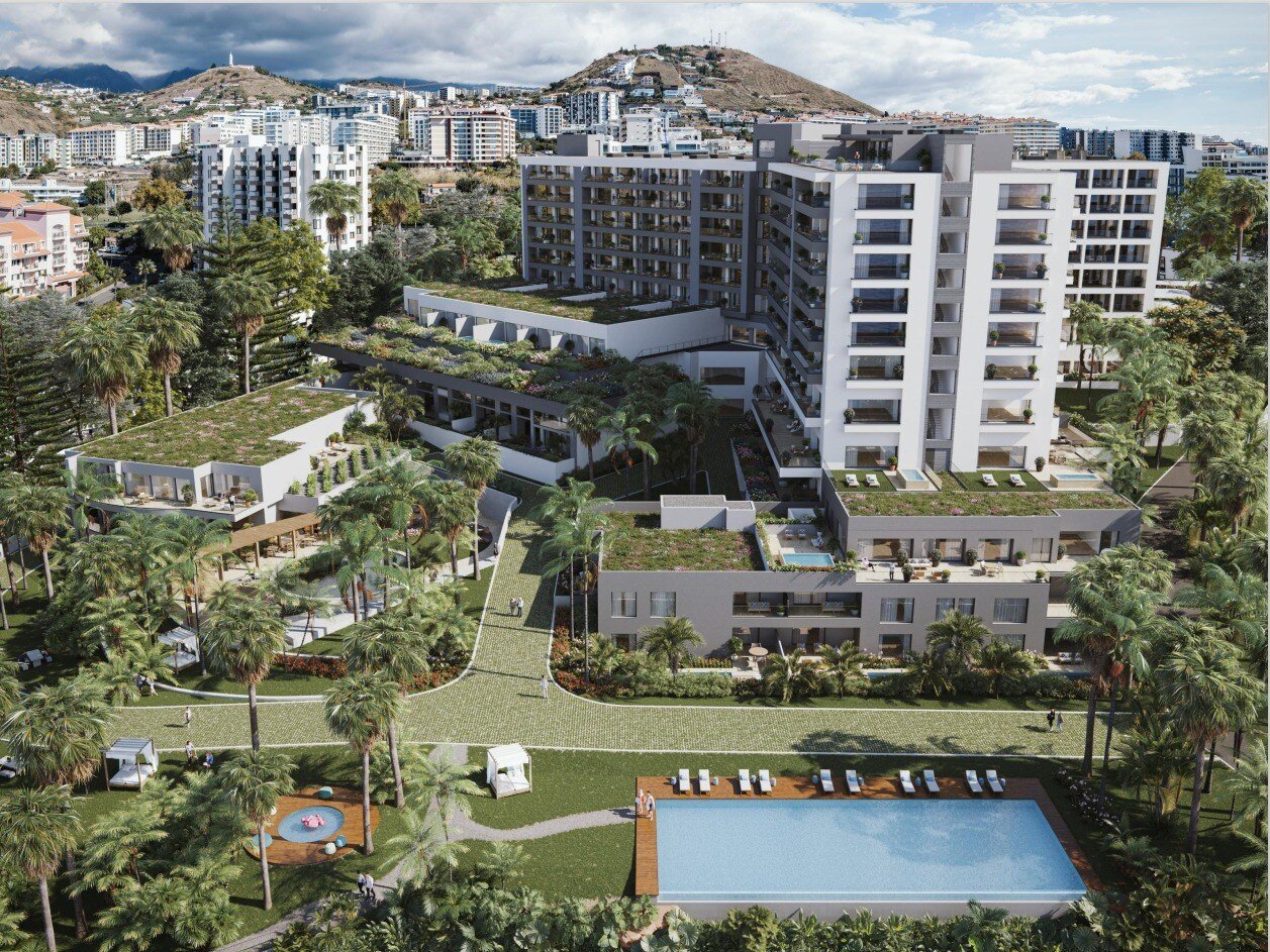 Bird's-eye view of the building and it's gardens and pools