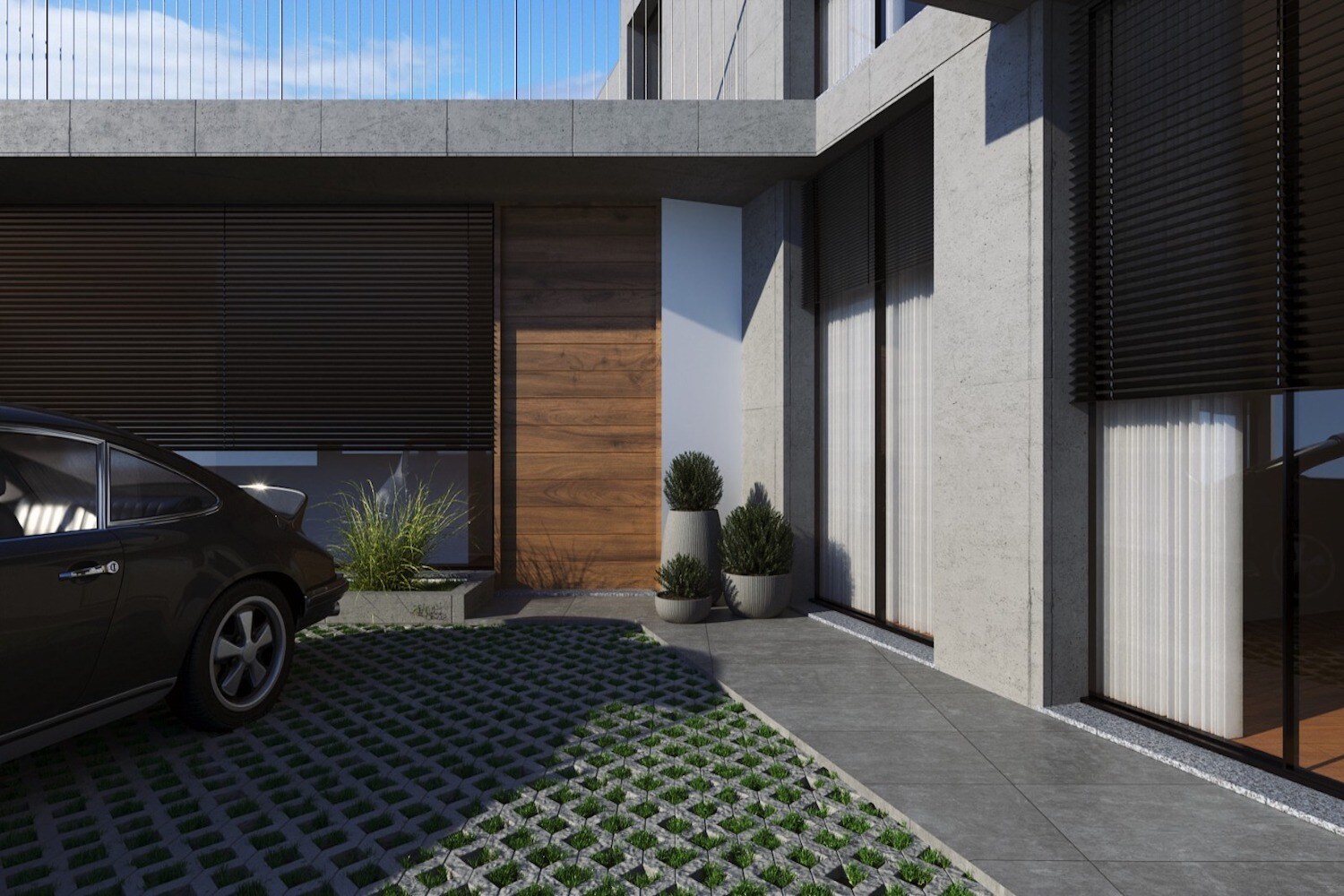 Garage entrance and paved driveway with a car