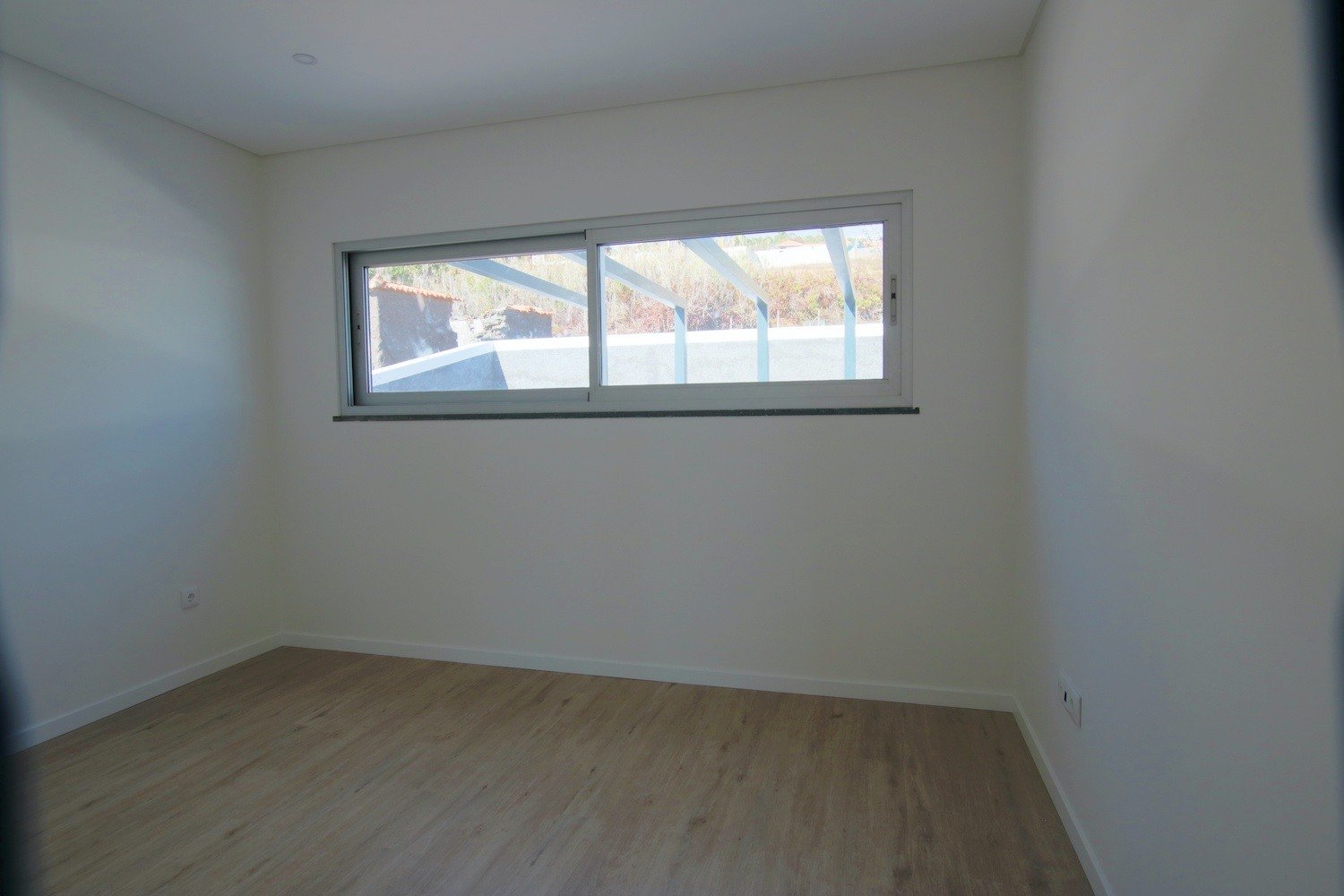 Bedroom with a large window