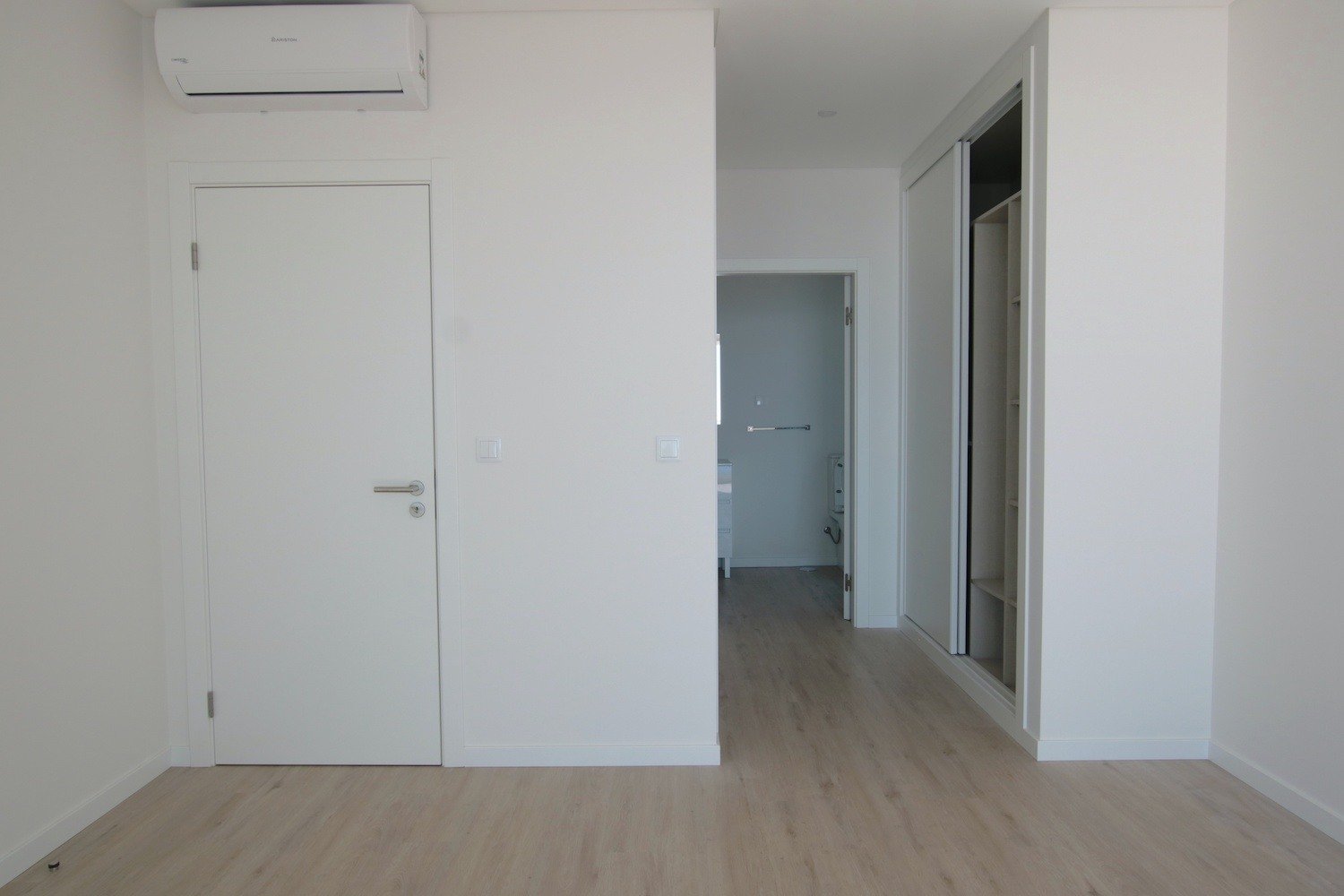 Bedroom with a bathroom in-suite with built in cupboards