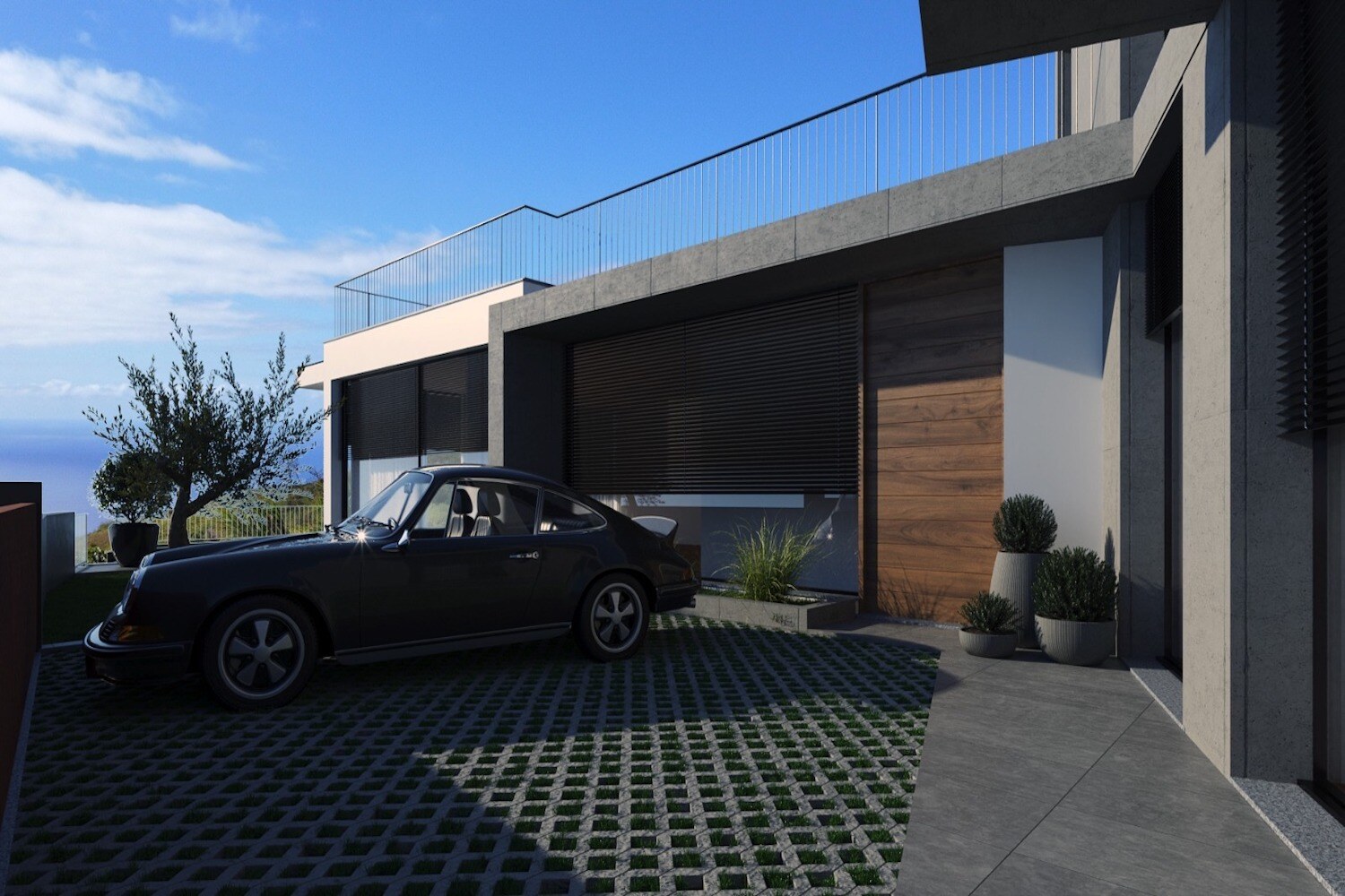 Garage entrance and paved driveway with a car